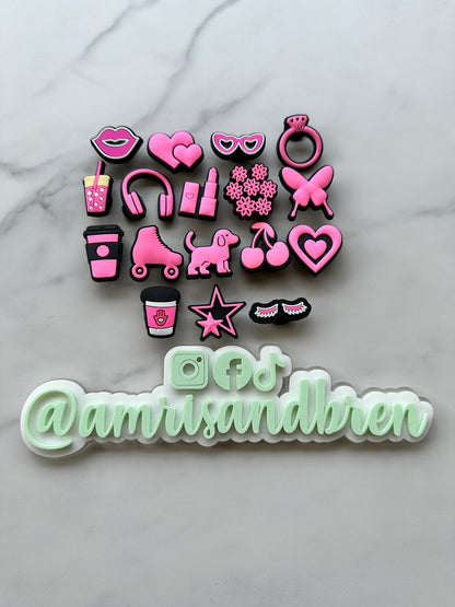 hot pink and black charms for your crocs, croc compatible black and pink shoe charms, trending shoe charms, butterfly, fist